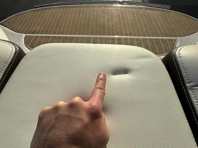 Slide: The Image of Finger pressing on Regal 2800 Bowrider 2016 boat seat, showing upholstery detail. - 41