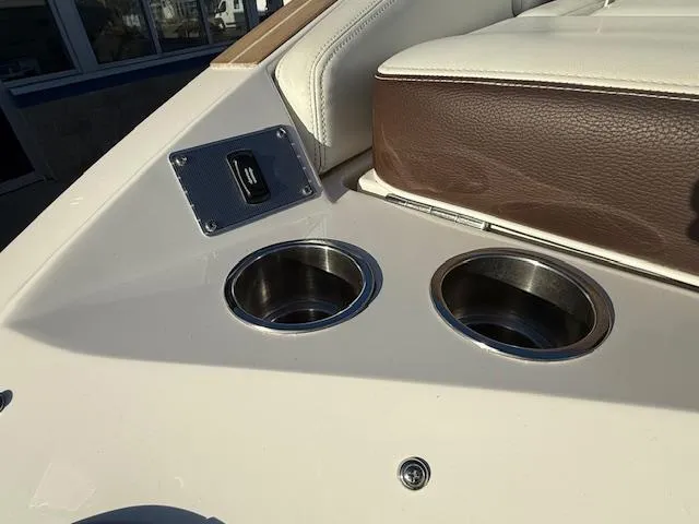 Slide: The Image of 2016 Regal 2800 Bowrider interior with cup holders and USB port. - 43