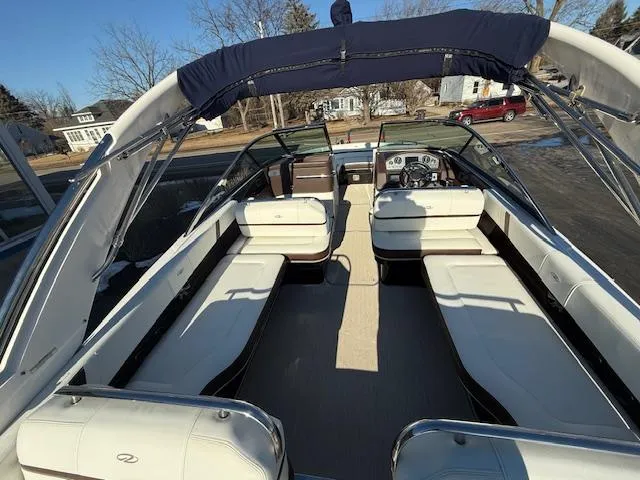 Slide: The Image of 2016 Regal 2800 Bowrider boat interior with spacious seating and modern dashboard. - 6