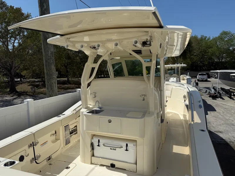 Slide: The Image of 2025 Scout 330 LXF boat with spacious deck and modern amenities. - 4
