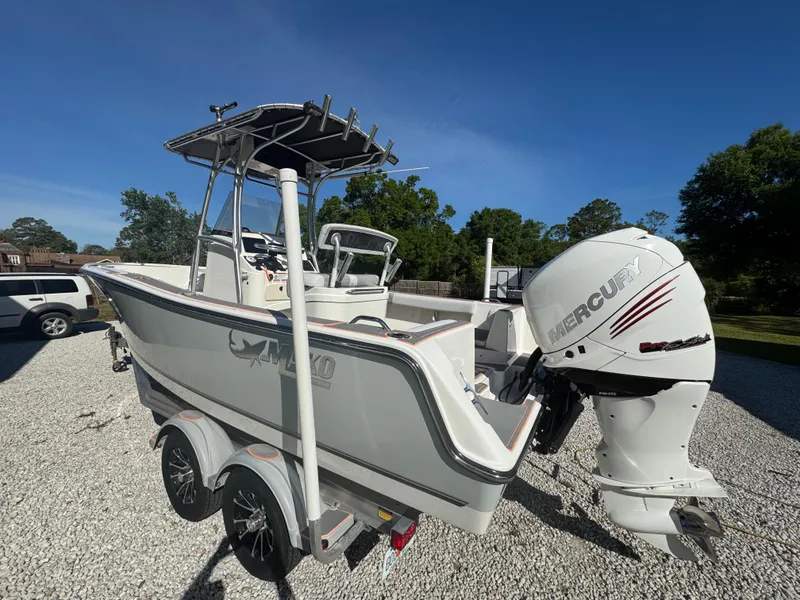 Slide: The Image of 2019 Mako 214C boat with Mercury outboard engine on a trailer. - 10