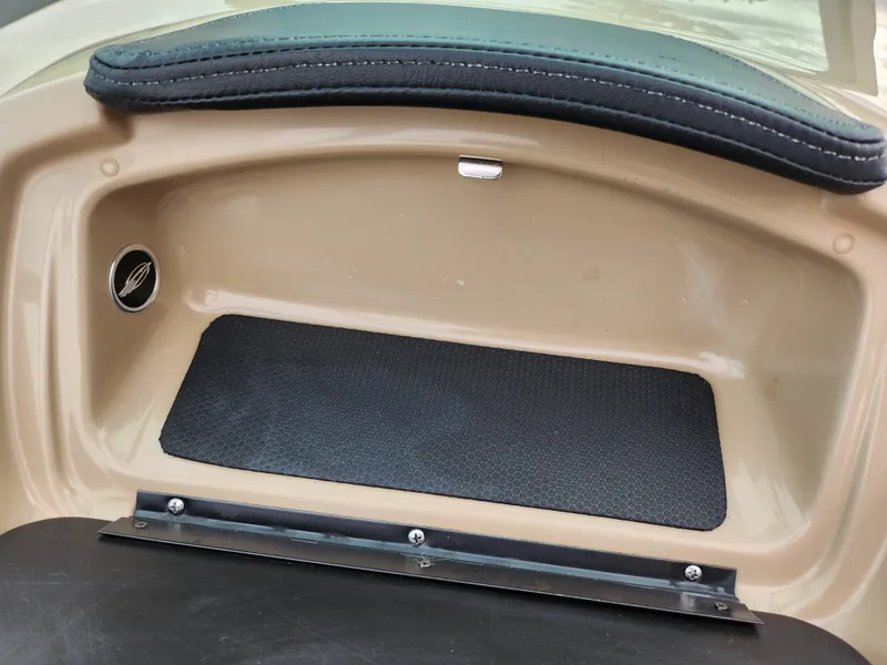 Slide: The Image of 2017 Chaparral 21 H2O Ski & Fish OB storage compartment with padded seating. - 14