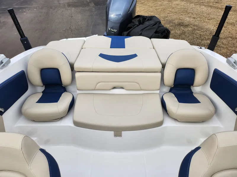Slide: The Image of 2017 Chaparral 21 H2O Ski & Fish OB boat interior with blue and white seating. - 26