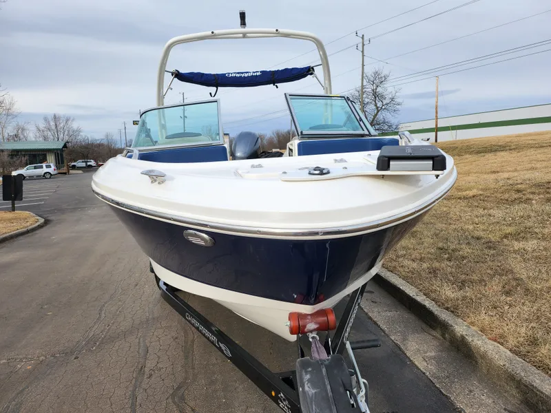 Slide: The Image of 2017 Chaparral 21 H2O Ski & Fish OB boat on trailer, parked outdoors. - 6