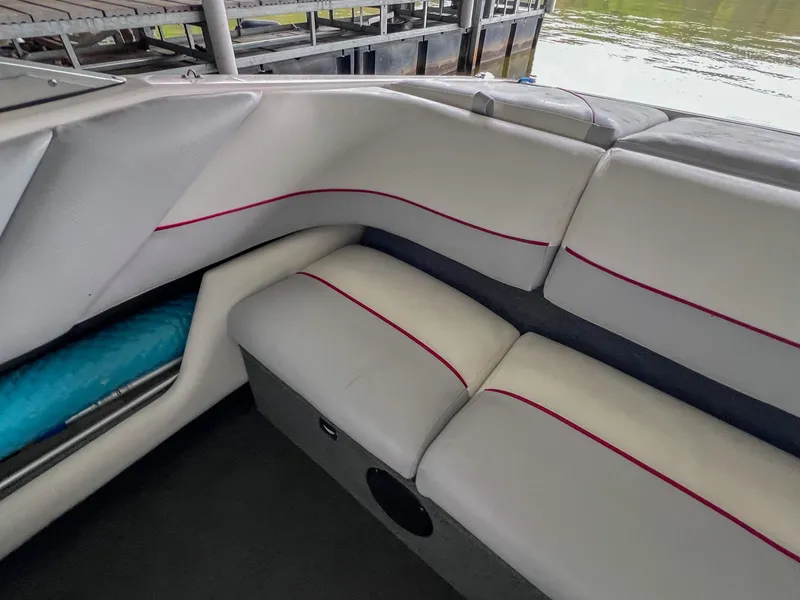 Slide: The Image of Interior of a 1993 Chaparral 2200 SL boat with white and red seating. - 11