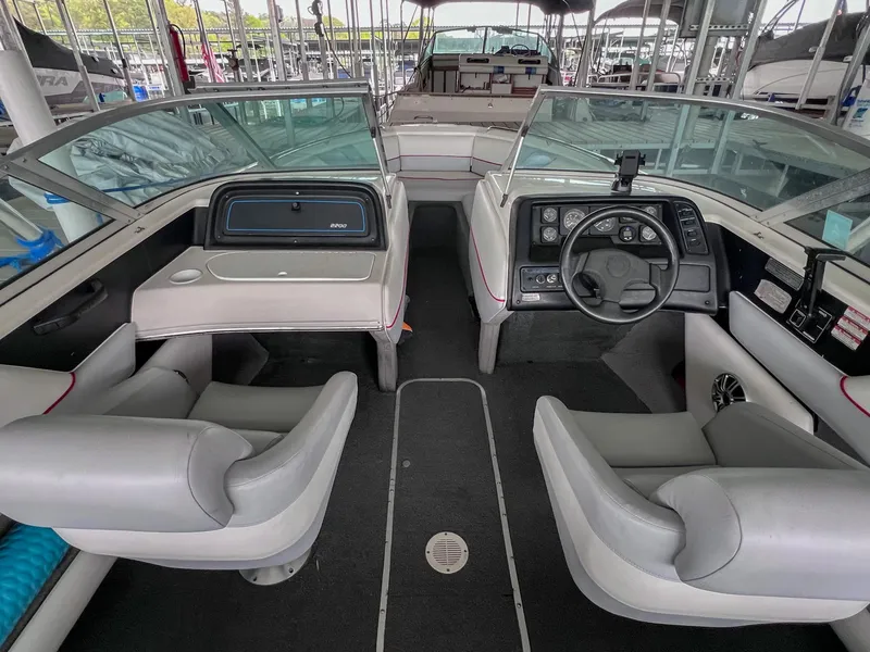 Slide: The Image of Interior of a 1993 Chaparral 2200 SL boat with dual seating and dashboard. - 14