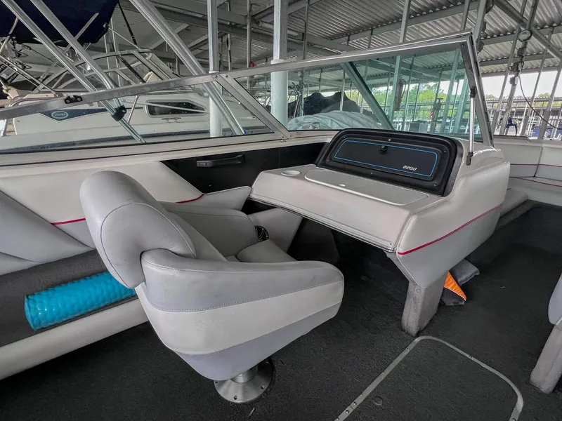 Slide: The Image of Interior of a 1993 Chaparral 2200 SL boat with gray seating and dashboard. - 21