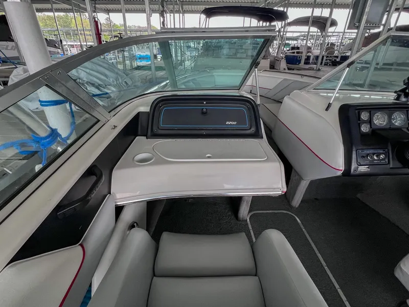 Slide: The Image of Interior of a 1993 Chaparral 2200 SL boat, featuring seating and dashboard controls. - 22
