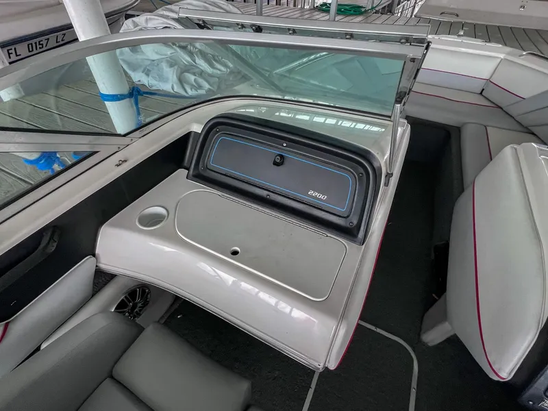 Slide: The Image of 1993 Chaparral 2200 SL boat interior with seating and dashboard view. - 23