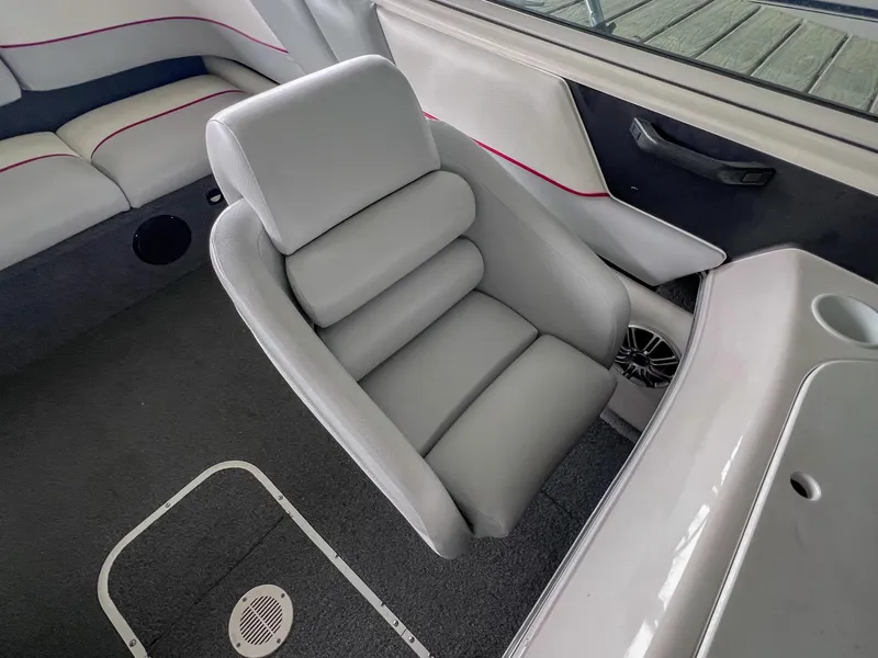 Slide: The Image of Interior of a 1993 Chaparral 2200 SL boat with gray seating and speaker. - 24