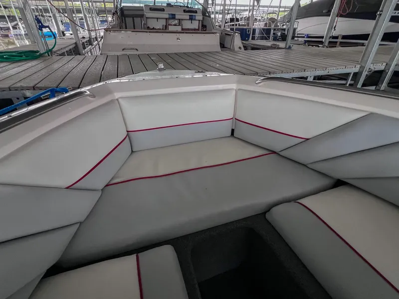 Slide: The Image of 1993 Chaparral 2200 SL boat interior with white and red cushioned seating. - 31