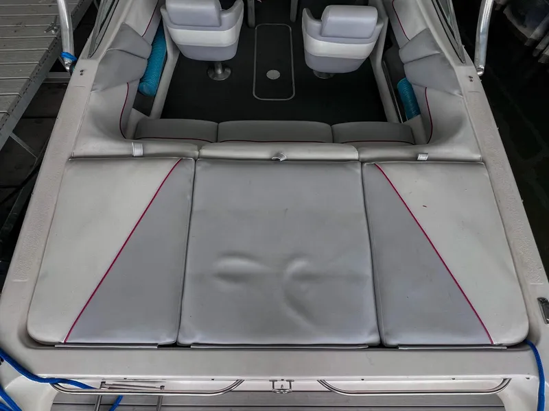 Slide: The Image of 1993 Chaparral 2200 SL boat interior with gray seating and red accents. - 6