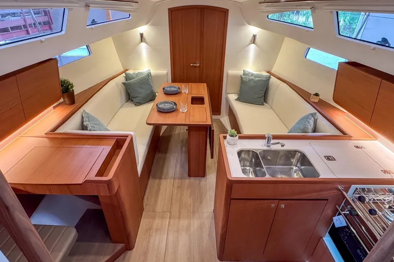 Slide: The Image of Luxurious interior of 2026 J Boats J/36 sailboat with modern kitchen and seating area. - 10
