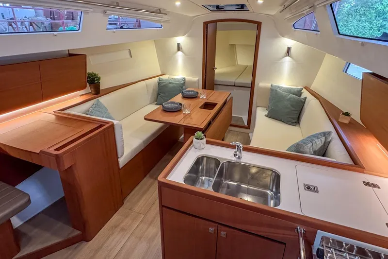 Slide: The Image of Luxurious interior of 2026 J Boats J/36 sailboat with modern kitchen and cozy seating. - 11