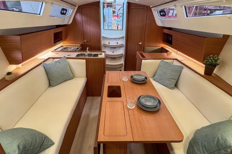 Slide: The Image of Luxurious interior of 2026 J Boats J/36 sailboat with elegant dining area and modern kitchen. - 12