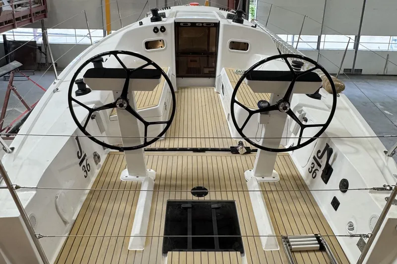 Slide: The Image of 2026 J Boats J/36 sailboat interior with dual steering wheels and teak flooring. - 16