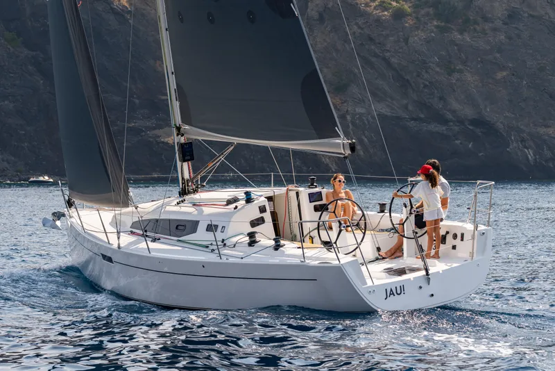 Slide: The Image of 2026 J Boats J/36 sailing with crew, sleek design, coastal backdrop. - 7