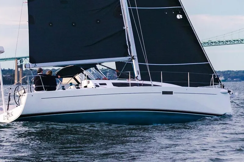 Slide: The Image of 2026 J Boats J/36 sailing yacht with black sails on open water. - 9