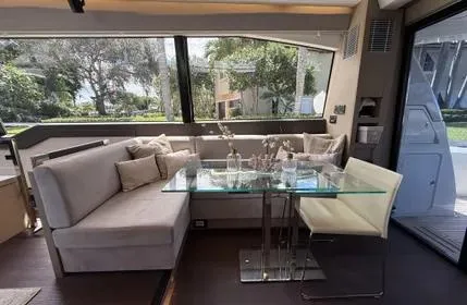 Slide: The Image of Luxurious interior of a 2018 Prestige 680 yacht with modern seating and glass table. - 13