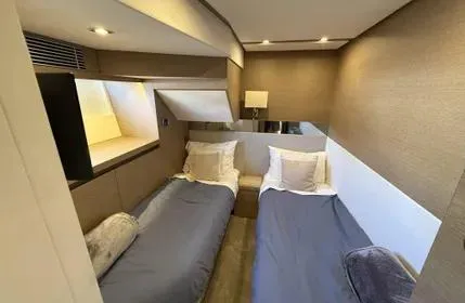 Slide: The Image of Interior of 2018 Prestige 680 yacht with twin beds and modern decor. - 18