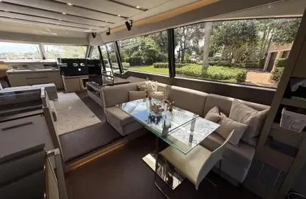 Slide: The Image of Luxurious interior of 2018 Prestige 680 yacht with elegant seating and glass table. - 19