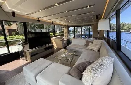 Slide: The Image of Luxurious interior of a 2018 Prestige 680 yacht with modern furnishings and large windows. - 2