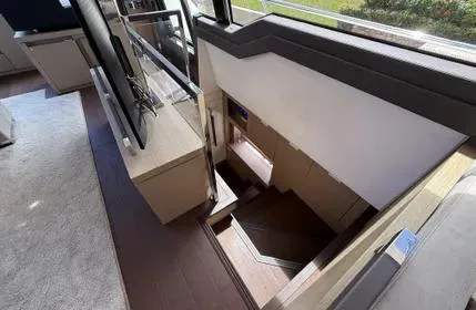Slide: The Image of Interior staircase of 2018 Prestige 680 yacht, featuring modern design and natural lighting. - 21