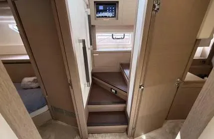 Slide: The Image of Interior of 2018 Prestige 680 yacht, featuring wooden stairs and modern design elements. - 23