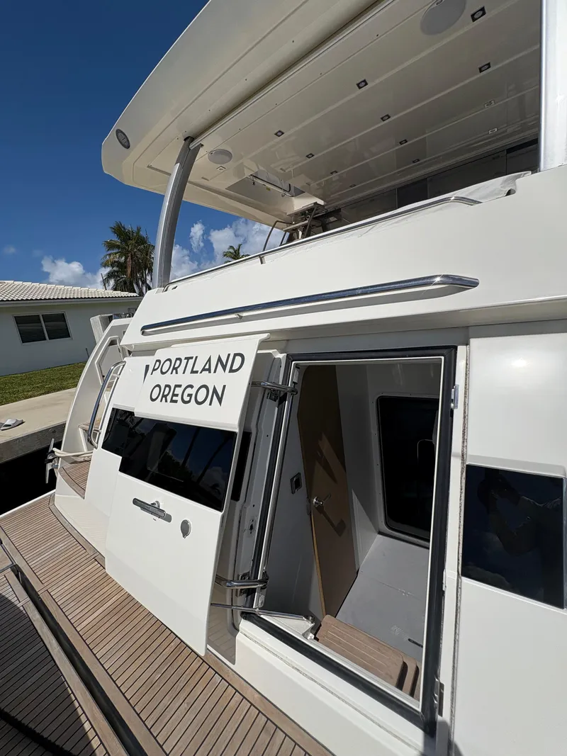 Slide: The Image of 2018 Prestige 680 yacht docked, featuring "Portland Oregon" text on the side. - 28