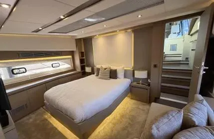 Slide: The Image of Luxurious bedroom interior of 2018 Prestige 680 yacht with modern design and ambient lighting. - 3