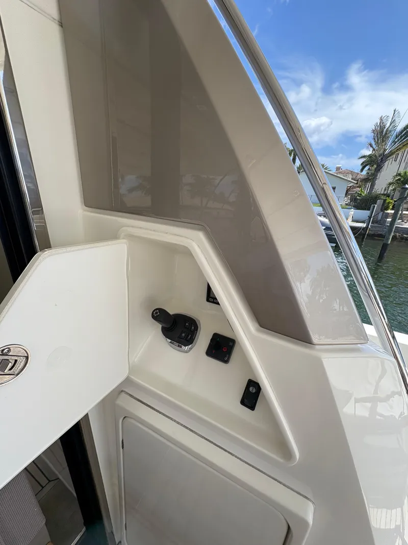 Slide: The Image of Control panel on a 2018 Prestige 680 yacht, featuring sleek design and waterfront view. - 37