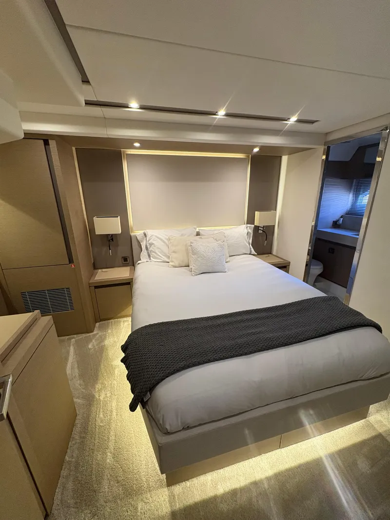 Slide: The Image of Luxurious bedroom interior of 2018 Prestige 680 yacht with modern design and ambient lighting. - 39