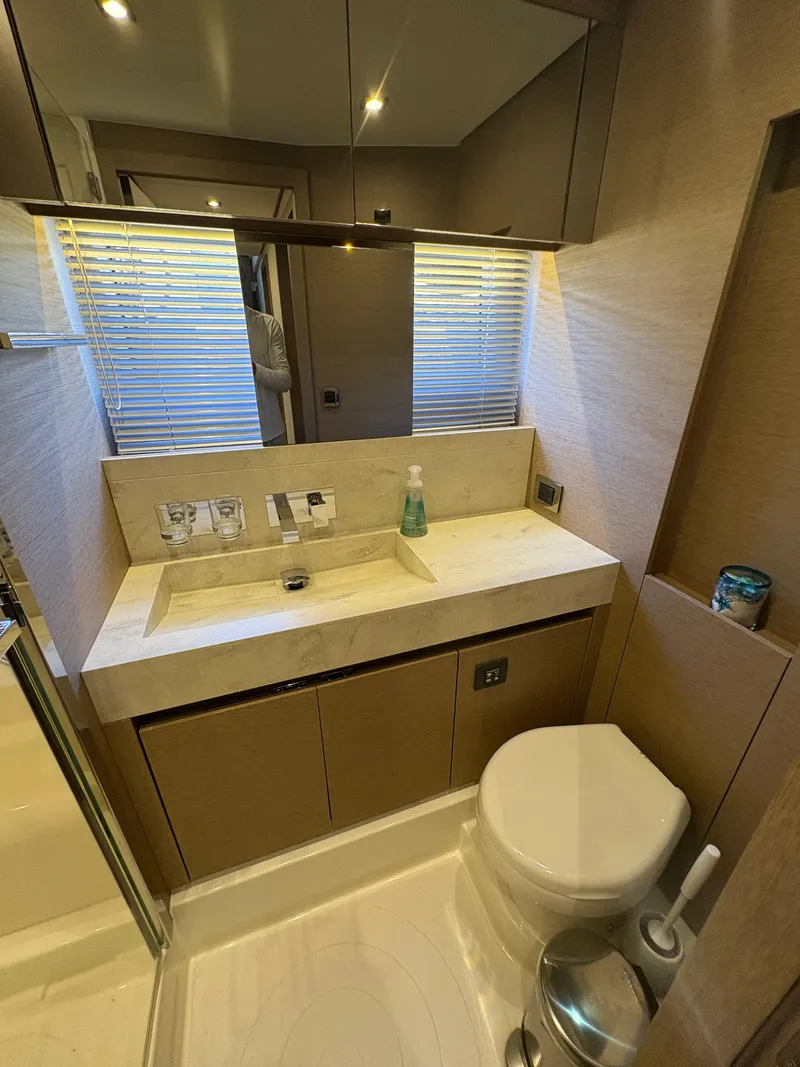 Slide: The Image of Luxurious bathroom in a 2018 Prestige 680 yacht with modern fixtures and elegant design. - 40
