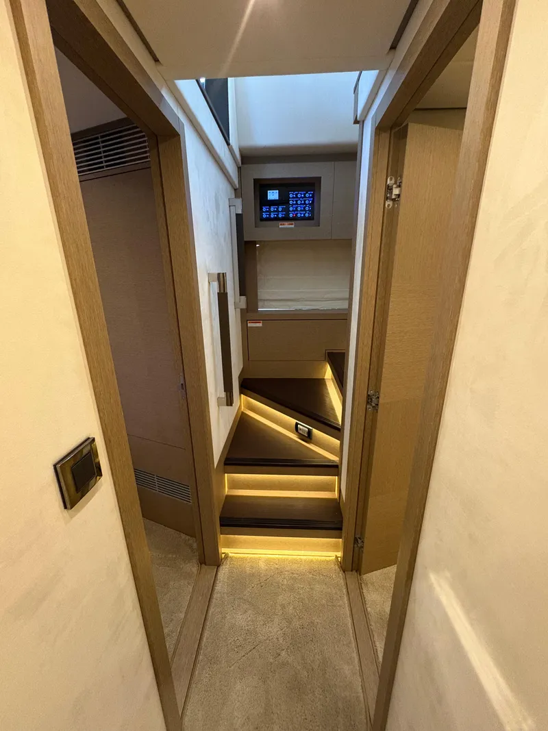 Slide: The Image of Interior of 2018 Prestige 680 yacht with modern staircase and ambient lighting. - 42