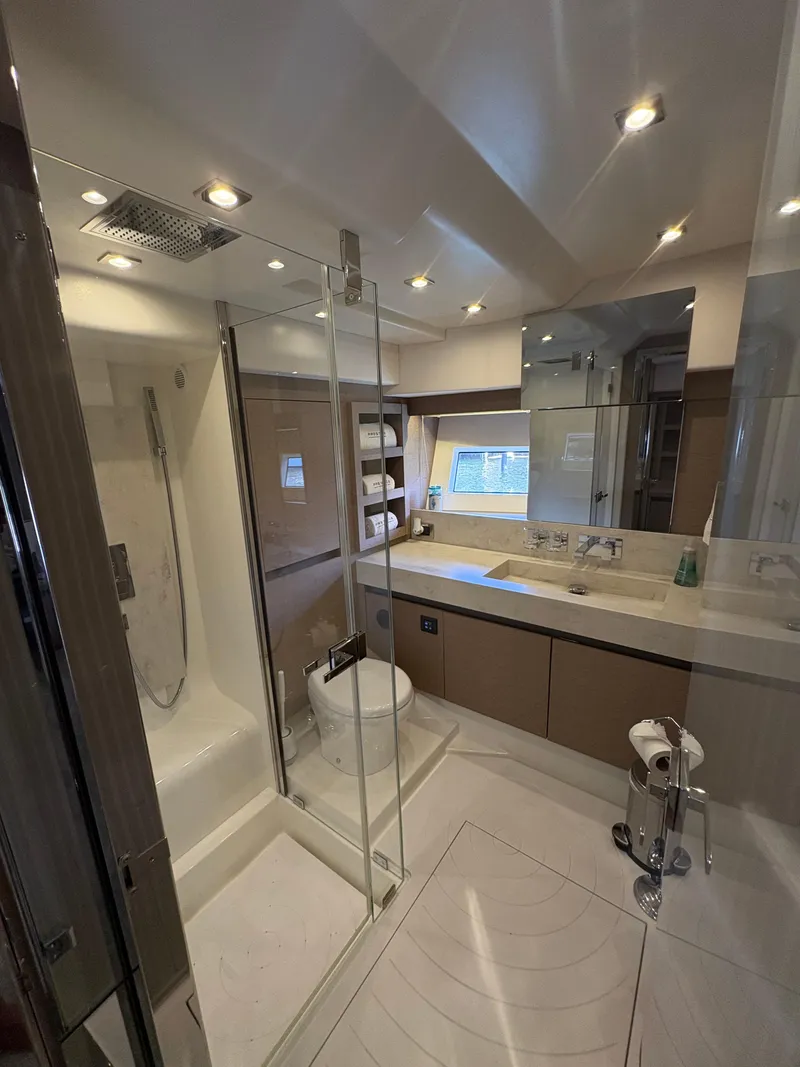 Slide: The Image of Luxurious bathroom in a 2018 Prestige 680 yacht with modern fixtures and elegant design. - 44