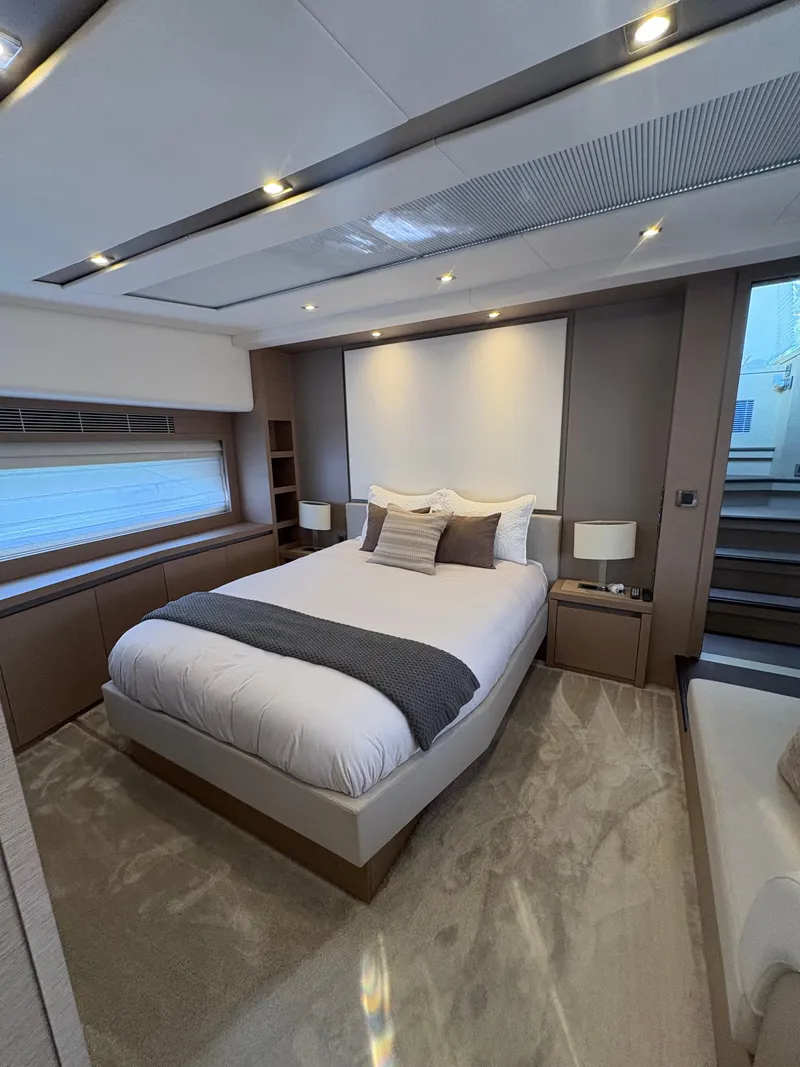 Slide: The Image of Luxurious bedroom interior of 2018 Prestige 680 yacht with modern design and cozy ambiance. - 46