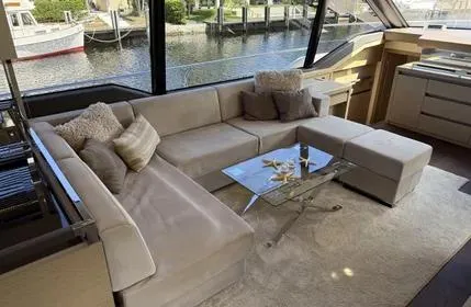 Slide: The Image of Luxurious interior of 2018 Prestige 680 yacht with plush seating and glass table. - 8