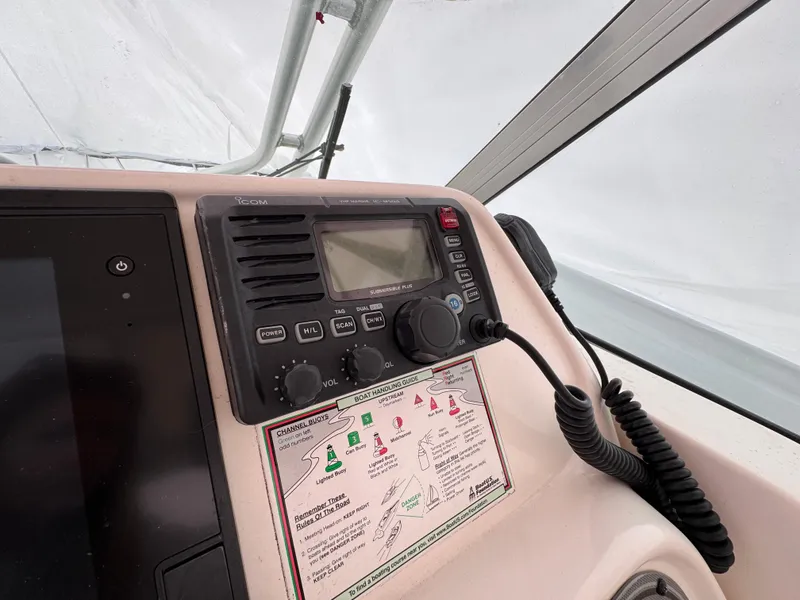 Slide: The Image of Control panel of a 2006 Wellcraft 290 Coastal boat with radio and navigation guide. - 10