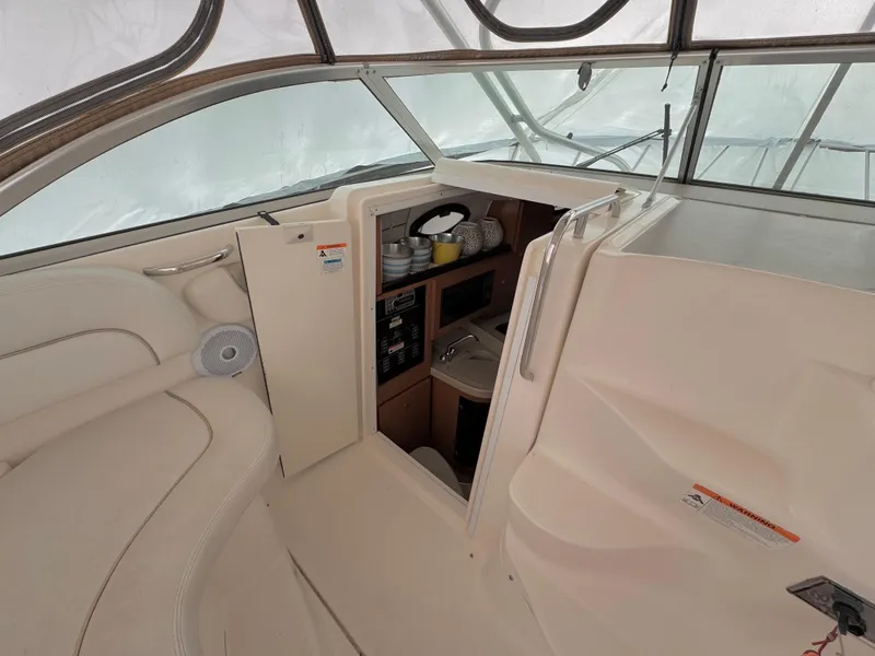Slide: The Image of 2006 Wellcraft 290 Coastal cabin interior with seating and helm area. - 11