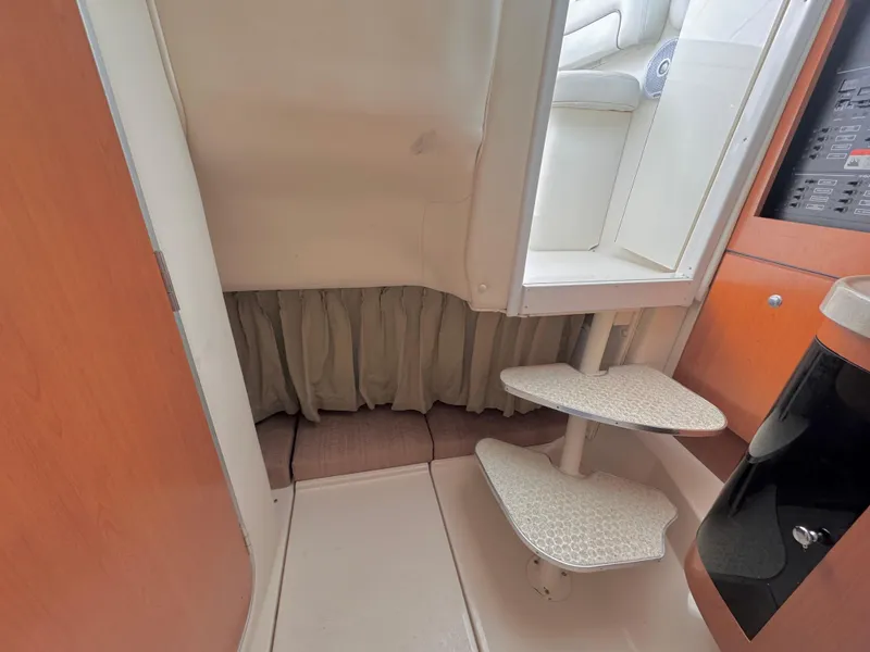 Slide: The Image of Interior view of 2006 Wellcraft 290 Coastal boat, featuring steps and cabin area. - 14