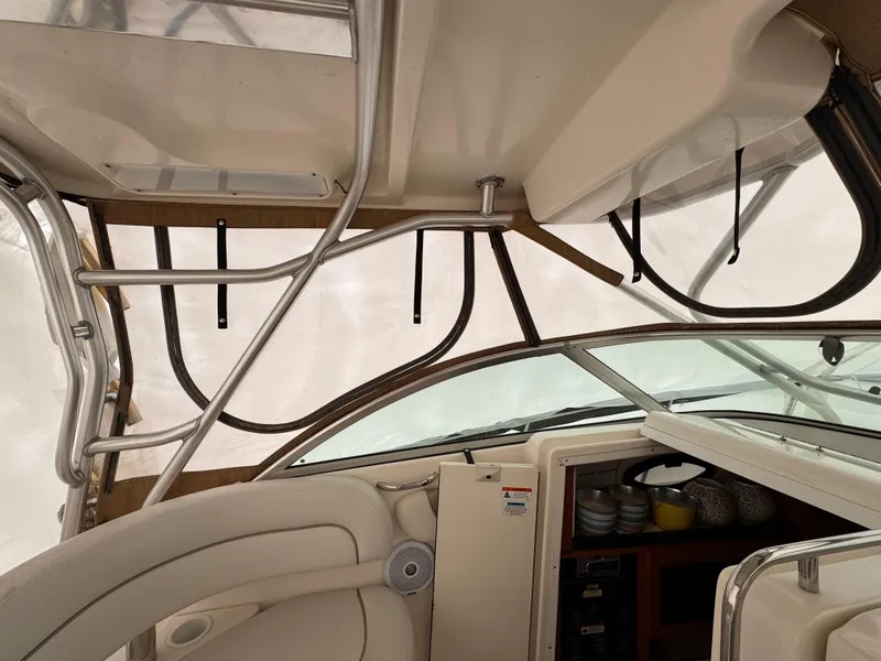 Slide: The Image of Interior view of 2006 Wellcraft 290 Coastal boat, featuring helm and seating area. - 20