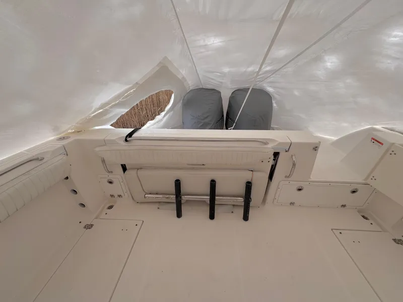 Slide: The Image of 2006 Wellcraft 290 Coastal boat interior with covered engines and storage compartments. - 4