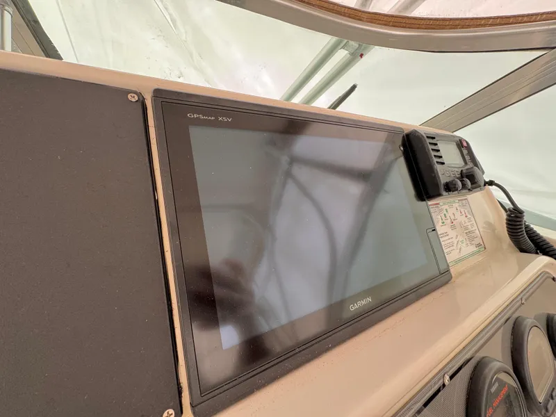 Slide: The Image of Dashboard of 2006 Wellcraft 290 Coastal with Garmin GPS and radio equipment. - 9