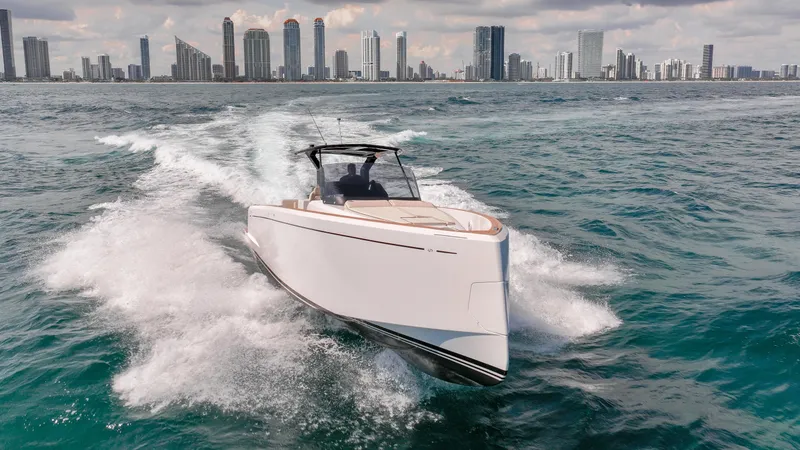 Slide: The Image of 2025 Pardo Yachts 38 cruising on ocean with city skyline in background. - 10