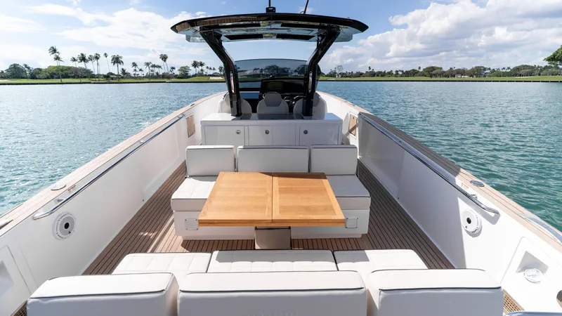 Slide: The Image of 2025 Pardo Yachts 38 with spacious deck and seating on calm water. - 13