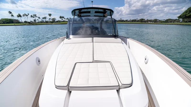 Slide: The Image of 2025 Pardo Yachts 38 on serene water, featuring spacious sunbathing deck. - 28