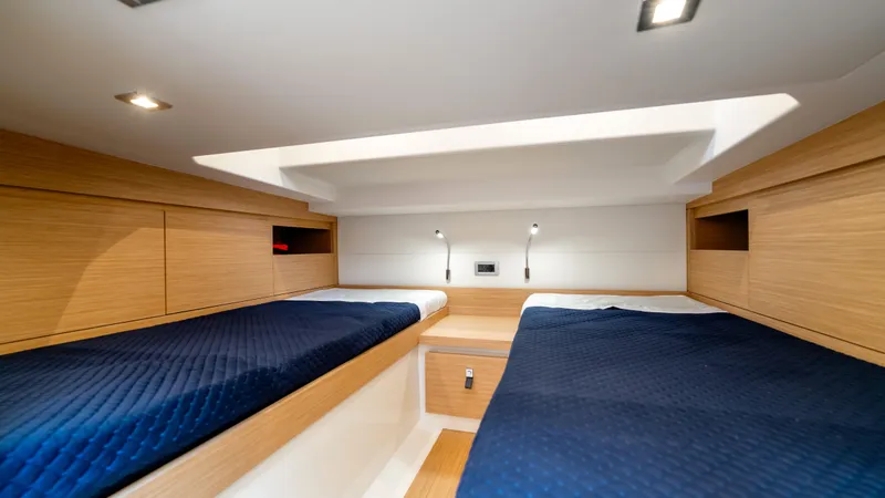 Slide: The Image of Interior cabin of 2025 Pardo Yachts 38 with twin beds and modern lighting. - 33