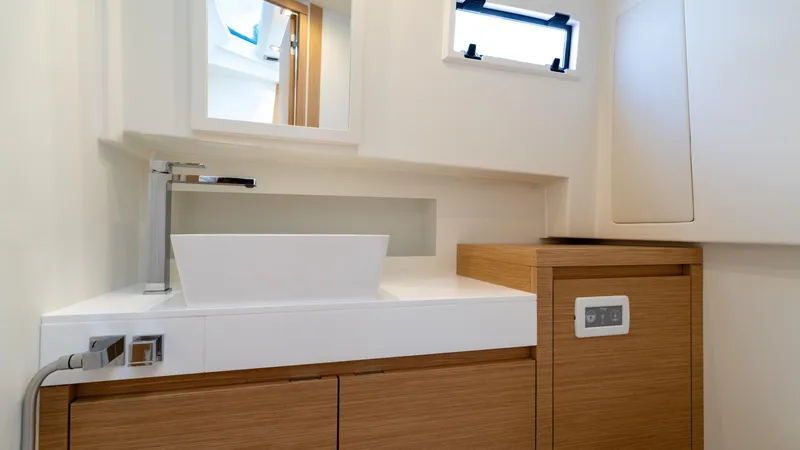 Slide: The Image of Modern bathroom interior of 2025 Pardo Yachts 38, featuring sleek sink and wooden cabinetry. - 37