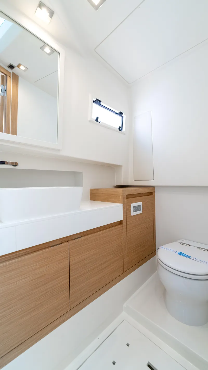 Slide: The Image of Modern bathroom interior of 2025 Pardo Yachts 38, featuring sleek design and wooden cabinetry. - 39