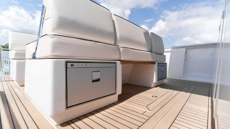 Slide: The Image of Luxury seating area on 2025 Pardo Yachts 38 with integrated storage, sleek design. - 16